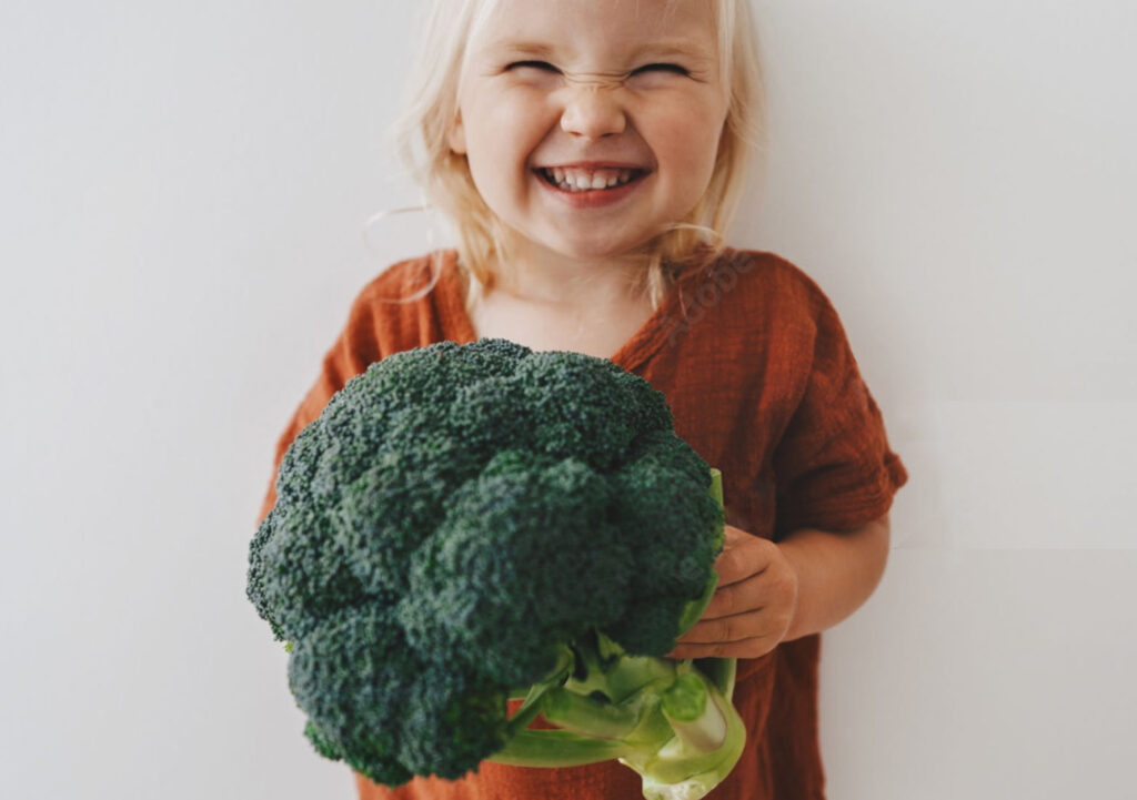 Shopper choosing fresh vegetables at a Sydney supermarket