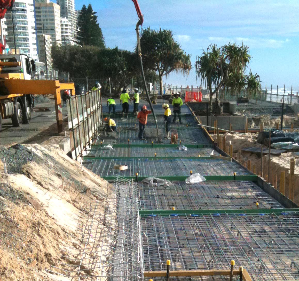 Concrete contractors pouring a replacement slab at a Gold Coast strata property