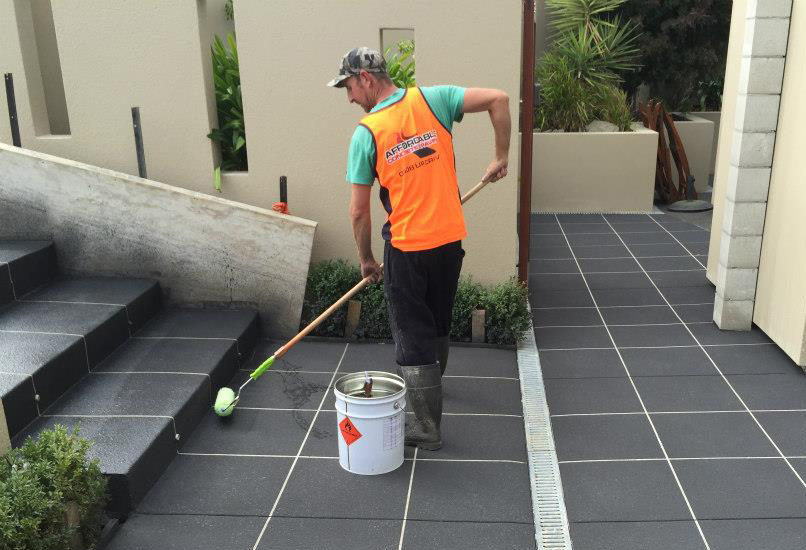 Concrete sealer being applied to a shared strata surface on the Gold Coast